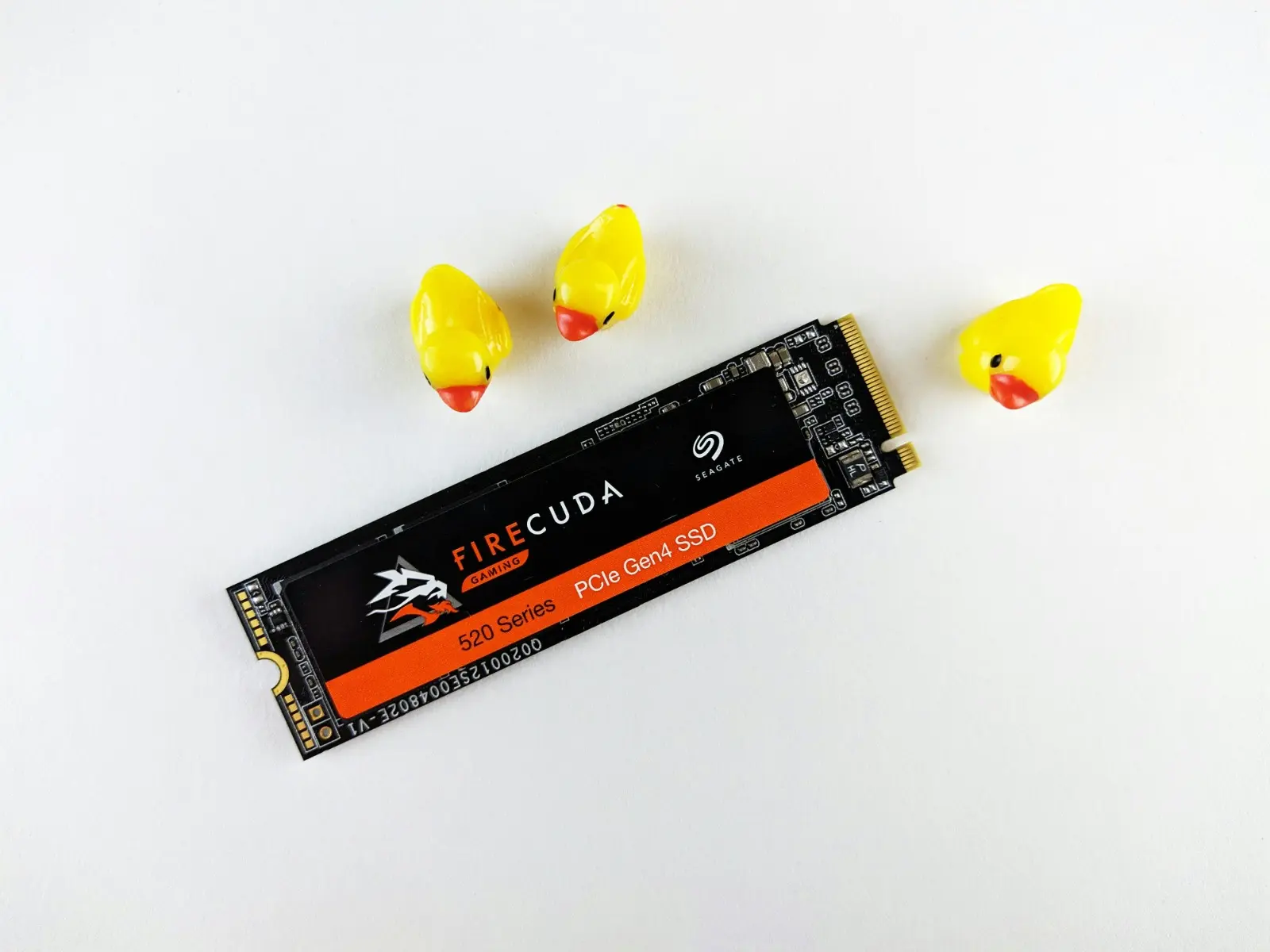 a small yellow ducks next to a black and orange rectangular object